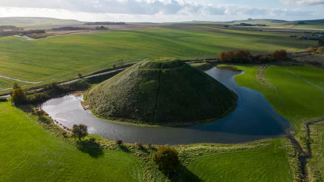 A moat has formed around the base of Silbury Hill in Wiltshire after heavy rainfall (Tom Wren / SWNS)