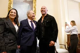 U.S. Majority Leader Chuck Schumer (D-NY) poses for photos with actor Dwayne Johnson (R) and XFL Co-Owner and CEO Dany Garcia (L) in his office at the U.S. Capitol Building on November 15, 2023 in Washington, DC. (Photo by Anna Moneymaker/Getty Images)