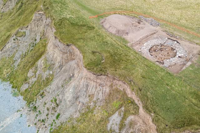 Clear evidence how the erosion of the cliffs due to climate change threatens the archeological site of the hillfort at Dinas Dinlle, Gwynedd (Paul Harris / N.Trust / SWNS)