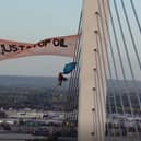 Just Stop Oil protesters Morgan Trowland and Marcus Decker scaled a bridge on the Dartford Crossing (Essex Police screengrab/PA)