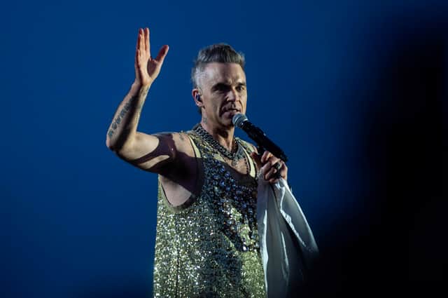 A woman who fell from the upper bandstand tier of Sydney's Allianz Stadium during a Robbie Williams concert has died. (Credit: Ritzau Scanpix/AFP via Getty Images)