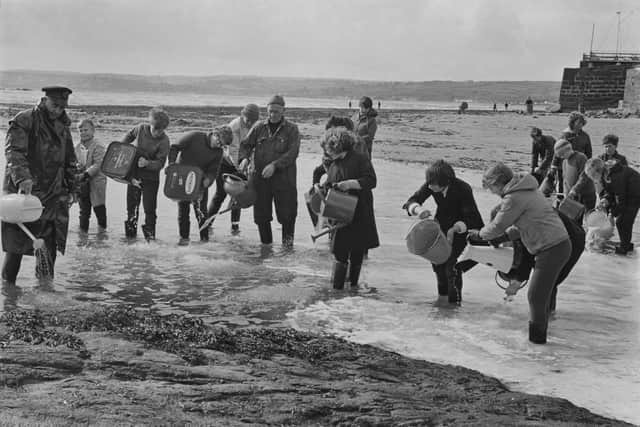 Volunteers tried o disperse the oil on the beach at Marazion after the Torrey Canyon oil spill in Cornwall. (Photo: Getty Images)