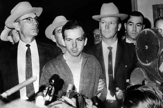 Picture dated 22 November 1963 of US President John F. Kennedy's murderer Lee Harvey Oswald during a press conference after his arrest in Dallas. Lee Harvey Oswald was killed by Jack Ruby on 24 November on the eve of Kennedy's burial. AFP PHOTO (Photo by STRINGER / AFP) 