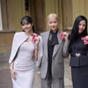 (left to right) Lisa (Lalisa Manoban), Rose (Roseanne Park), Jisoo Kim and Jennie Kim, from the K-Pop band Blackpink pose with their Honorary MBEs (Members of the Order of the British Empire), awarded to them in recognition of the band's role as COP26 advocates for the COP26 Summit in Glasgow 2021. King Charles III conducted the special Investiture ceremony in the presence of the President of South Korea, Yoon Suk Yeol, and his wife, Kim Keon Hee at Buckingham Palace, London. Picture date: Wednesday November 22, 2023. (Credit: PA)