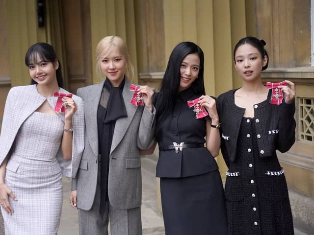 (left to right) Lisa (Lalisa Manoban), Rose (Roseanne Park), Jisoo Kim and Jennie Kim, from the K-Pop band Blackpink pose with their Honorary MBEs (Members of the Order of the British Empire), awarded to them in recognition of the band's role as COP26 advocates for the COP26 Summit in Glasgow 2021. King Charles III conducted the special Investiture ceremony in the presence of the President of South Korea, Yoon Suk Yeol, and his wife, Kim Keon Hee at Buckingham Palace, London. Picture date: Wednesday November 22, 2023. (Credit: PA)