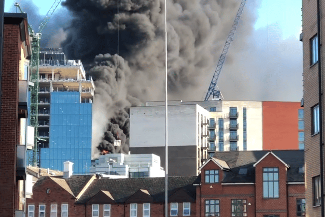 A huge fire broke out at a high-rise in Reading with a workman rescued from a nearby roof. (Credit: @tomcanning83/X)