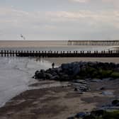 Caravans at Parkefield Holiday Park, Lowestoft, Suffolk, have been evacuated after the collapse of a cliff there led to the discovery of a suspected unexploded bomb. Stock image of Lowestoft beach by Getty Images.