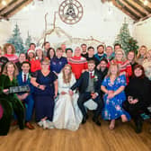 Katelen Cheshire and Billy Green with their guests at their christmas themed wedding, which was gifted to them. Photo by SWNS.