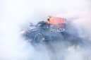 Race winner Max Verstappen of the Netherlands driving the (1) Oracle Red Bull Racing RB19 performs donuts on track during the F1 Grand Prix of Abu Dhabi at Yas Marina Circuit on November 26, 2023 in Abu Dhabi, United Arab Emirates. (Image: Clive Rose/Getty Images)