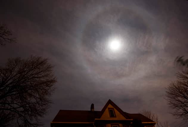 A halo or icebow appears around the moon above New York City (Photo: DON EMMERT/AFP via Getty Images)