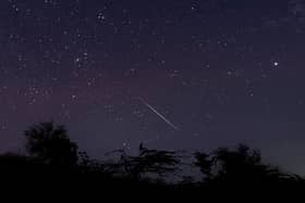 A meteor streaking through the night sky over Myanmar during the Geminid meteor shower (Photo: YE AUNG THU/AFP via Getty Images)