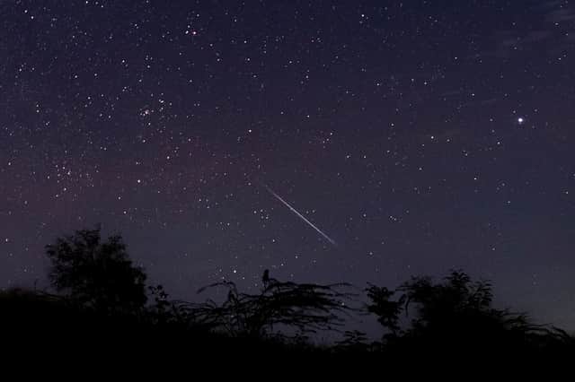 A meteor streaking through the night sky over Myanmar during the Geminid meteor shower (Photo: YE AUNG THU/AFP via Getty Images)