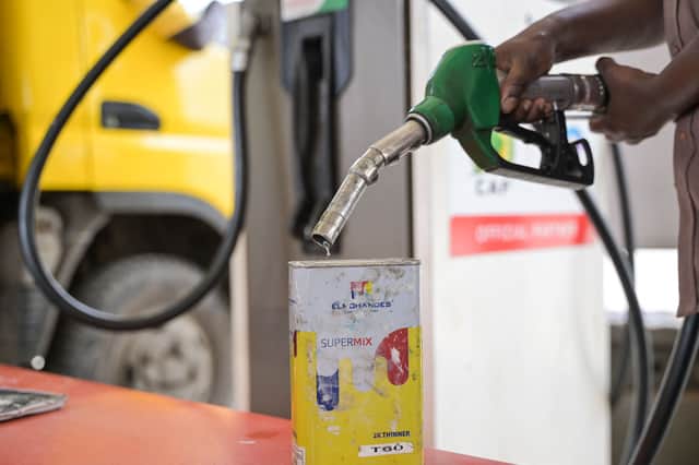 A pump attendant pumps fuel into a jerrican at a gas station in Nairobi (Image: SIMON MAINA / AFP)