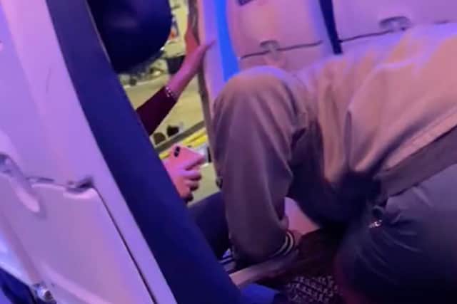 Emergency exit onboard November 26 flight to Atlanta from Louis Armstrong International Airport was opened by a passenger who escaped through it distressing fellow passengers. (@zedweb08 /TMX / SWNS)