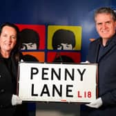 The manager of The Beatles Story Mary Chadwick, with Mayor of Liverpool City Region Steve Rotheram, holding a Penny Lane street sign which was stolen by drunk students and has been returned to Liverpool 47 years later which will go on display in The Beatles Story museum (Kevin Matthews/PA Wire)