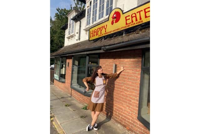 Katie Nicholls outside a former Happy Eater restaurant in Hooley, Croydon (@the_happy_eater_hunter)