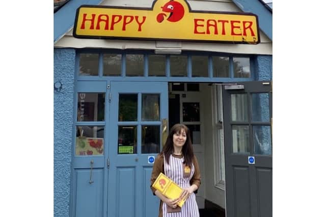 Katie Nicholls outside a former Happy Eater restaurant in Burgh Heath  (@the_happy_eater_hunter)