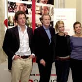 Hugh Grant, Bill Nighy, Heike Makotsch, Lucia Monic, and Duncan Kenworthy prior to giving a news conference ahead of the release of Love Actually in 2003 (Photo: HERWIG VERGULT/AFP via Getty Images)