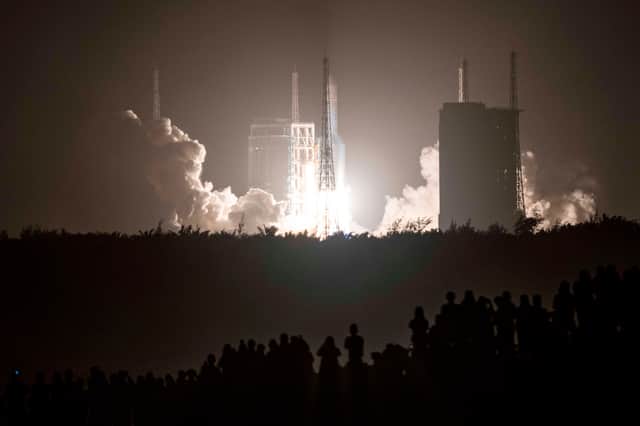 A Long March 5 rocket carrying China's Chang'e-5 lunar probe launches from the Wenchang Space Center on China's southern Hainan Island on November 24, 2020 Picture: STR/AFP via Getty Images