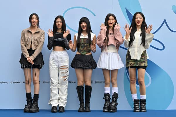 K-pop girl group NewJeans members, from left, Hyein, Haerin, Hanni, Danielle and Minji pose on the blue carpet at the 2024 Spring/Summer Seoul Fashion Week at Dongdaemun Design Plaza in September Picture: Jung Yeon-je / AFP
