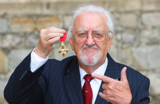 Bernard Cribbins poses with his Officer of the British Empire (OBE) medal after receiving it during an investiture ceremony with the Princess Anne, Princess Royal at Windsor Castle, on November 03, 2011 in Windsor, England. (Photo by Chris Ison - WPA Pool/Getty Images)