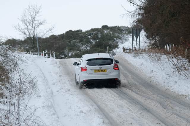Drivers have been warned of "very treacherous" road conditions after snow "refreezes overnight" causing parts of UK to be like "an ice rink". (Photo: Getty Images).
