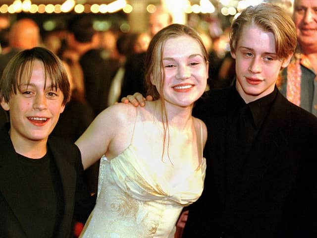 Culkin brothers, Kieran, left, and Macaulay pose with actress Rachel Minor at the premiere of Miramax film The Mighty in which Kieran had a role in 1998 Picture: Getty