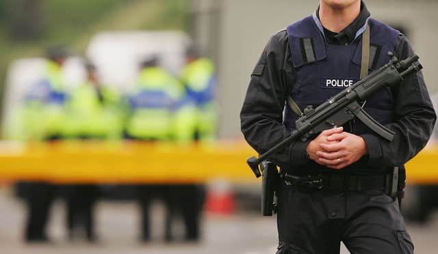 A 29-year-old woman has been stabbed as armed officer search for a male suspect in the Welsh village of Aberfan. (Credit: Getty Images