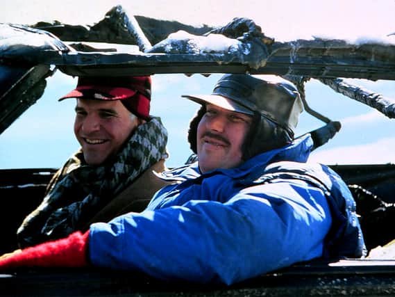 Steve Martin and John Candy in the quintessential getting home in time for the holiday's feature, "Planes, Trains and Automobiles" (Credit: Paramount)