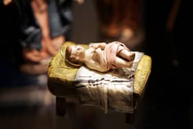 A scuplture of a baby Jesus that is part of a nativity scene from Spain is displayed during a "Joy to the World" exhibit December 9, 2004 in Washington, DC (Image: Joe Raedle/Getty Images)