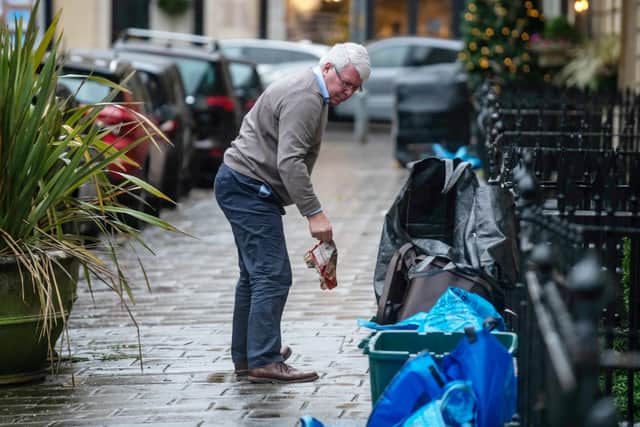 Residents of one street say they dread bin day - as they face the prospect of separating their rubbish into THIRTEEN different bags, boxes and containers. ( SWNS)