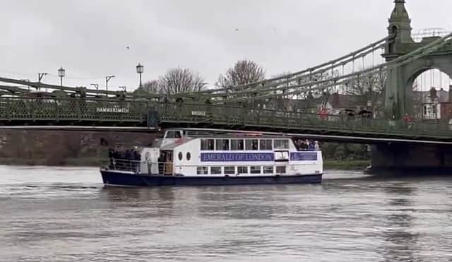 Issued by Mortlake Brewery, of the MV Emerald of London, captures wedged beneath Hammersmith Bridge in west London