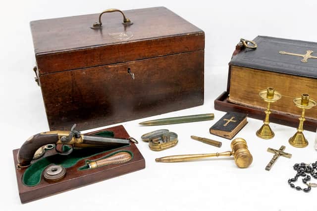 The kit, housed in a wooden box with original key, holds a mix of mainly 19th  century objects hidden away within a leather-bound Cassell Bible (Hansons London/ Mark Laban/ SWNS)