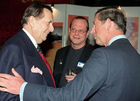 King Charles, the then Prince Charles with the late Sir Barry Humphries. King Charles sent a tribute message to his memorial service in Australia. Photograph by Getty