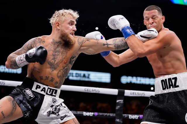 Jake Paul throws a left at Nate Diaz during the first round of their fight at the American Airlines Center on August 05, 2023 in Dallas, Texas