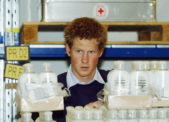 The Nazi-costume scandal happened in 2005. Here is  Prince Harry helping pack tsunami aid items bound for the Maldives at a Red Cross depot on January 7, 2005 in Warmley, England. Photograph by Getty