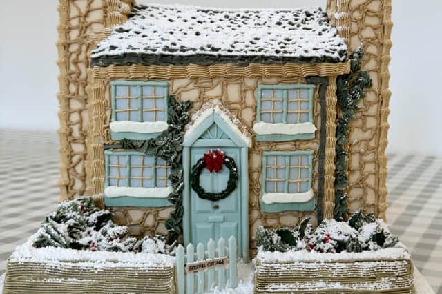 A cake made by Bridie West, a cake baker from Essex, has gone viral on TikTok after making an "entirely edible" version of Rosehill cottage from the Christmas film The Holiday. Photo by Bridie West/PA Wire.
