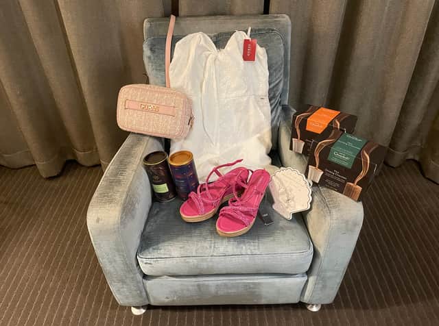 The items NationalWorld repoorter Rochelle Barrand purchased during a trip to London's 02 shopping outlet., including a playsuit and handbag from Guess, sandals from Next and hot chocolate from both Whittard and Hotel Chocolat. Photo by Rochelle Barrand.