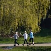 Elderly women walk at a fast pace in a park (Image: Sean Gallup/Getty Images)