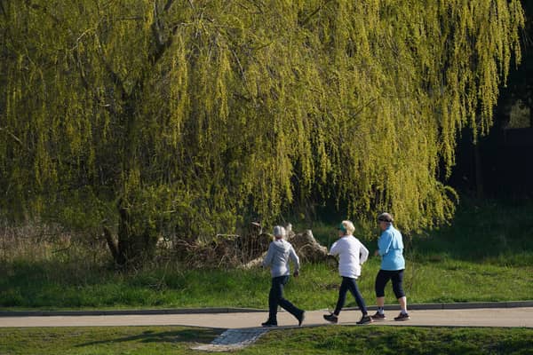 Elderly women walk at a fast pace in a park (Image: Sean Gallup/Getty Images)