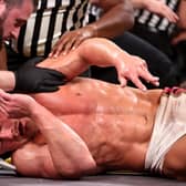NXT Champion Ilja Dragunov was stretchered out after his match against Ridge Holland in the final WWE NXT episode before Christmas (Credit: WWE)