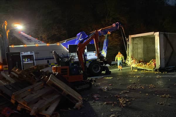 An overturned lorry spilled 22 tonnes of potatoes onto the M5 - with people forced to pick up the vegetables by hand, with lanes closed. (Credit: National Highways)