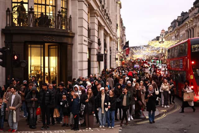 Busy scenes of Christmas shoppers on Regent Street in London (Photo: HENRY NICHOLLS/AFP via Getty Images)