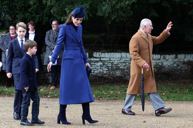 Kate Middleton wore a royal blue Alexander McQueen coat for Christmas Day 2023. Photograph by Getty