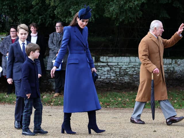 Kate Middleton wore a royal blue Alexander McQueen coat for Christmas Day 2023. Photograph by Getty
