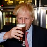 Boris Johnson with a pint of beer. One of his big Brexit dividends - the return to imperial measures - has been scrapped by the government. Credit: Getty
