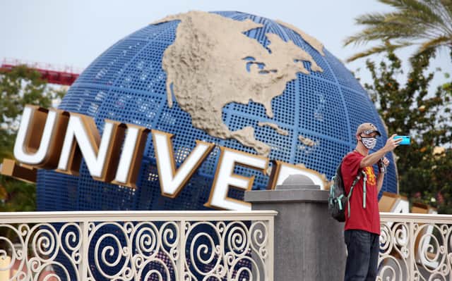 A visitor takes a selfie at Universal Studios theme park in Orlando, Florida
