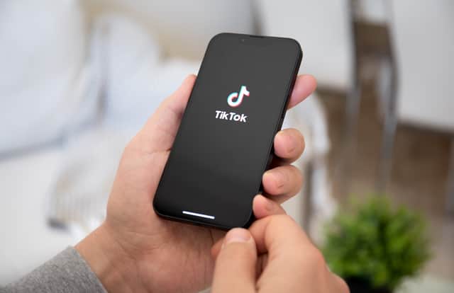 iPhone users have been left baffled as they've been asked to submit their device passcodes before they can use the TikTok app. Stock image by Adobe Photos.