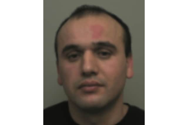 Giannis Shonda - a warrant has been issued for his arrest on domestic abuse offences by Northamptonshire Police