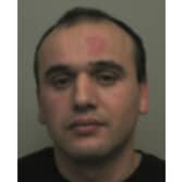 Giannis Shonda - a warrant has been issued for his arrest on domestic abuse offences by Northamptonshire Police